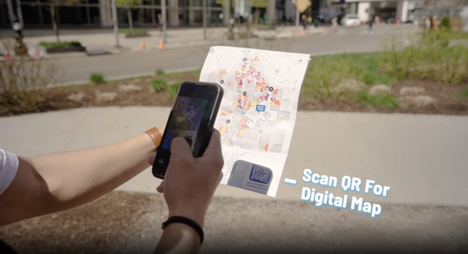 A visitor scanning a QR code to access a digital map